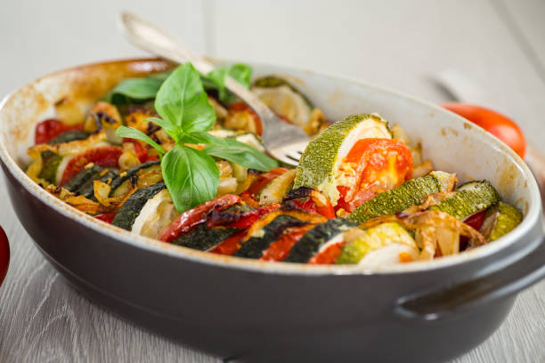 istock prepared baked zucchini and tomatoes in circles in a ceramic form, vegetable snack 2178733132