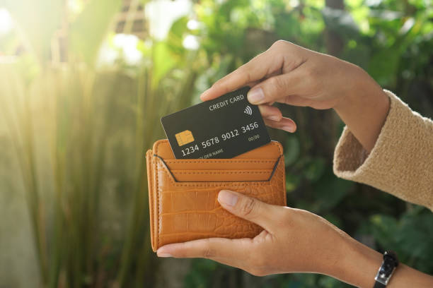 Black credit card put in wallet