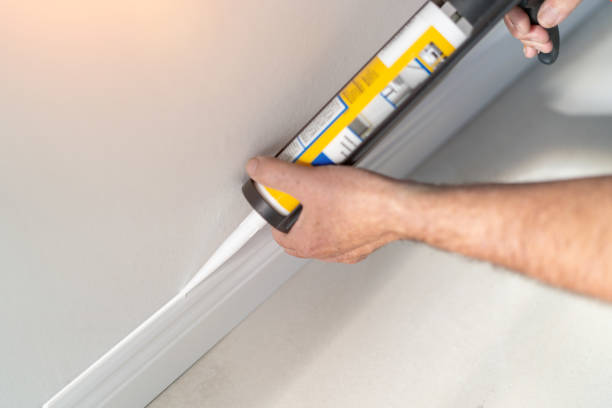 istock Man installing new skirting board - DIY home work concept 2178735035