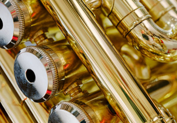 Generic valved brass musical instrument. Close up shot, abstract musical industry background.