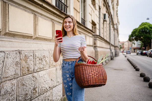 istock Woman going home from the public market 2178738228