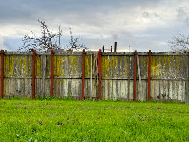 istock Weathered Wooden Fence with Moss and Rust 2178740023