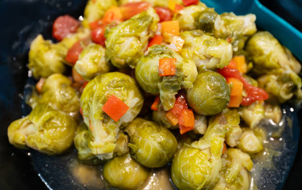 Heap of fresh green Brussels sprouts displayed at a local farmer’s market, ideal for healthy eating and organic food concepts.