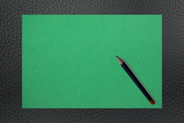 Black leather desk top and blotter  Pencil  paper write  text space