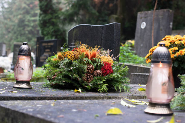 istock graves during All Saints Day, cemetery during religion holiday,autumn atmosphere 2178749832