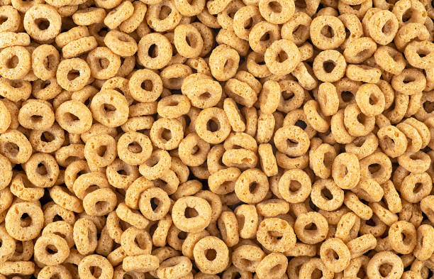 istock Sweet breakfast cereal rings as background, top view. Healthy breakfast. Cereal background. Whole grain oat cereals. 2178750050