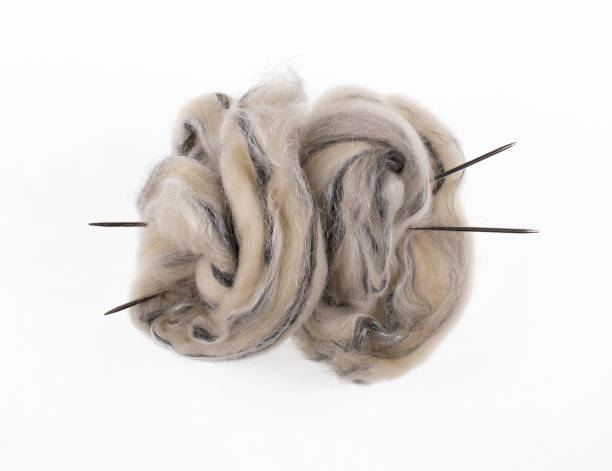 istock skein of gray wool with knitting needles isolated on white background 2178750189