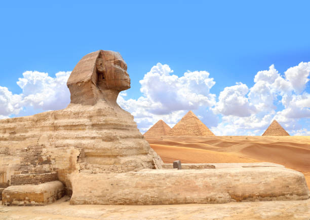 istock Famous Great Sphinx and pyramids of Chephren, Cheops, Menkaure, Cairo, Egypt. Great Pyramids and statue of Sphinx, mythical creature with head of man and body of lion, Giza complex (Giza Necropolis) 2178751525