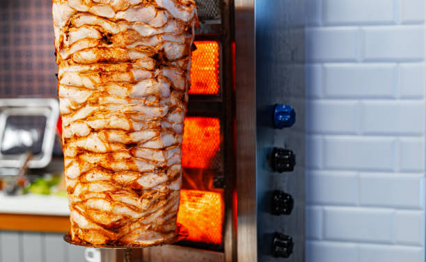 istock Juicy meat is fried on a shawarma spit. 2178752055