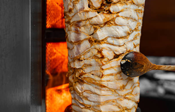 istock Juicy meat is fried on a shawarma spit. 2178752124