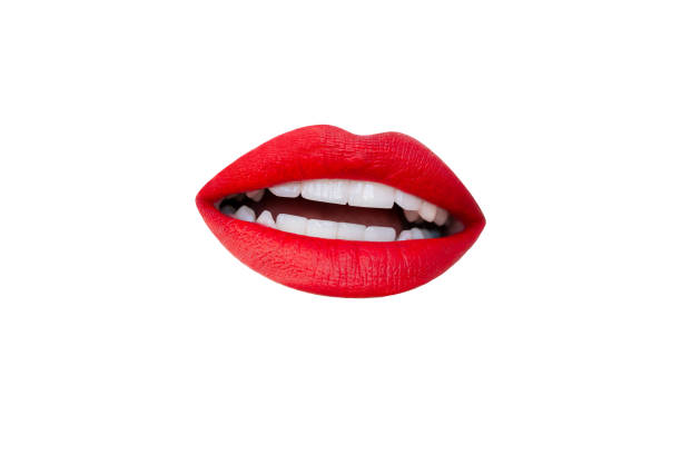 istock Woman's slightly open mouth with red lips showing teeth isolated on a white background 2178752540