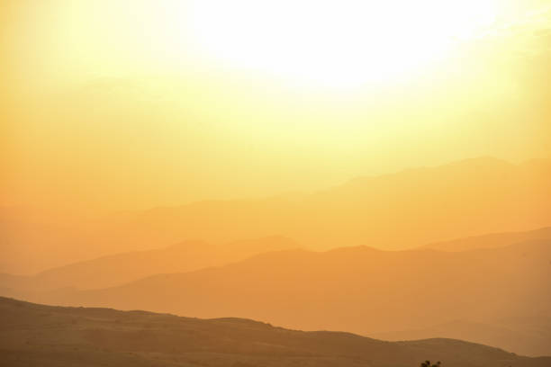The Beautiful sunset over the mountains in the summer.