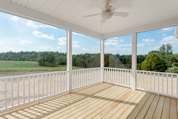 istock Sunlit Porch With Railing And Scenic Countryside View 2178753541