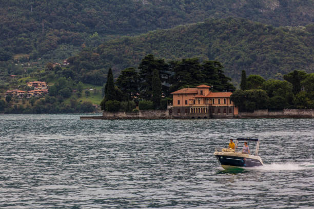 Tranquil waters of Lake Iseo, with the distant mountains embracing the horizon.