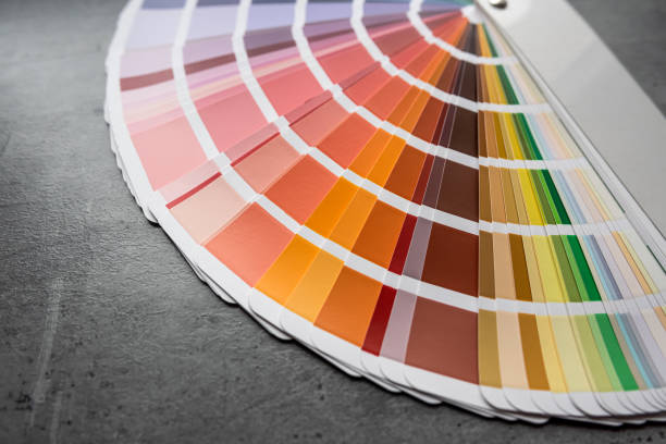 istock Rainbow catalog of paints with a various color palette on grey desk 2178756124