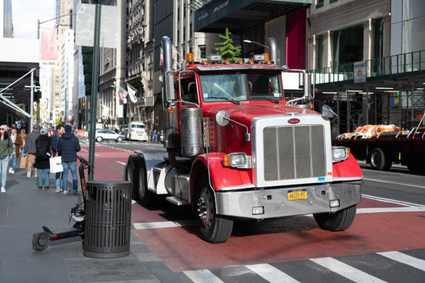 New York City, USA - November 11, 2023: 2013 Peterbilt 367 TRI AXLE truck on the road, front view.