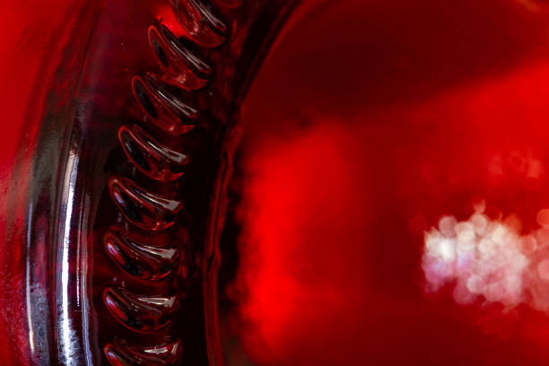 istock Closeup of glass bottle bottom with red liquid 2178760992
