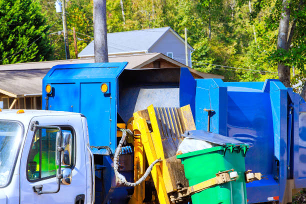 istock Waste disposal by municipal cleaning services involves loading mixed domestic waste onto a garbage truck. 2178763090