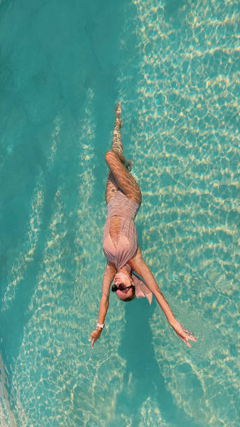 istock Stunning girl in swimming pool 2178763367