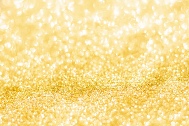 Gold glitter defocused texture background. gold christmas abstract background