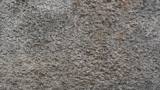 Textured Surface of Rough Stone With Natural Patterns in Outdoor Setting