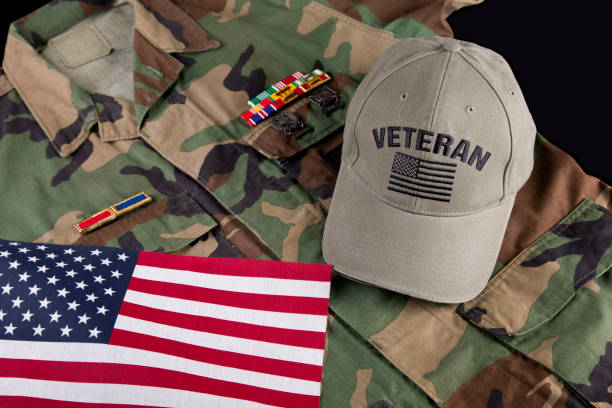istock American veterans cap and jacket with American Flag 2178771720
