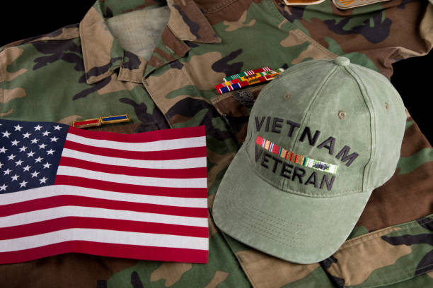 istock Vietnam veterans jacket, cap, decorations and American Flag 2178771805