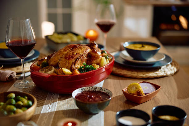 istock Thanksgiving table setting with roast turkey and side dishes. 2178772072