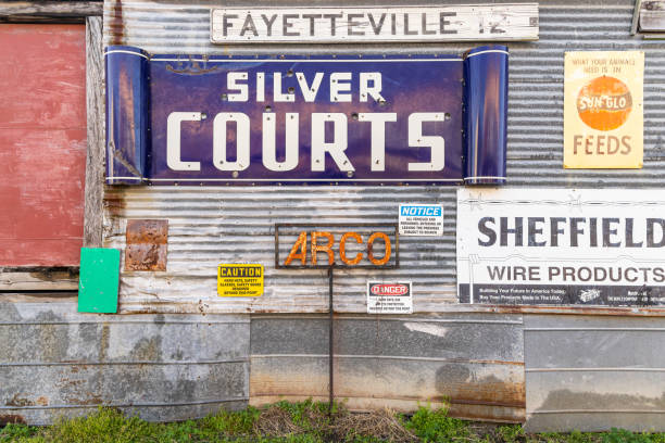 Yoakum, Texas, United States. March 17, 2022. Antique signs on a corrugated metal building.