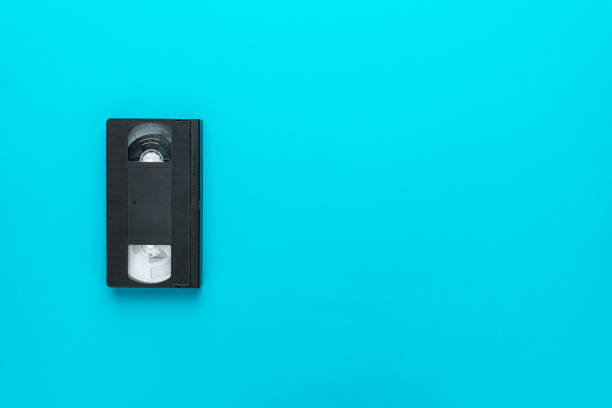 istock Retro video tape over turquoise blue background with copy space 2178773751