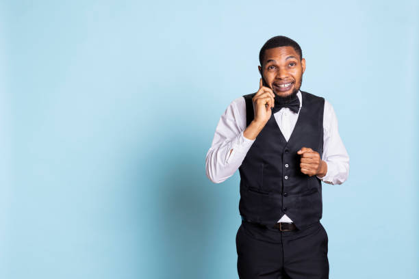 istock Professional front desk personnel chatting on phone call with guests 2178774128