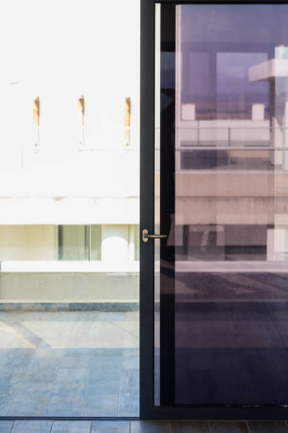 istock A Sleek Modern Door Opens to Reveal a Bright, Sunlit Balcony With Architectural Simplicity During a Serene Afternoon 2178774816