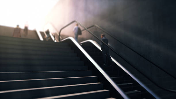 istock People Go Up Stairs and Escalators Towards the Light, New Beginnings Concept 2178775450