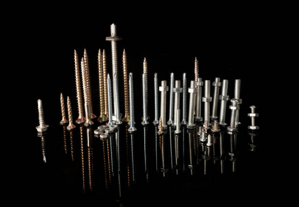 Screws on a black background simulating a city with reflections in the water