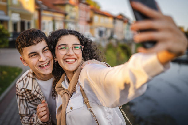 istock Young happy couple take a self portrait with river in the background 2178778897