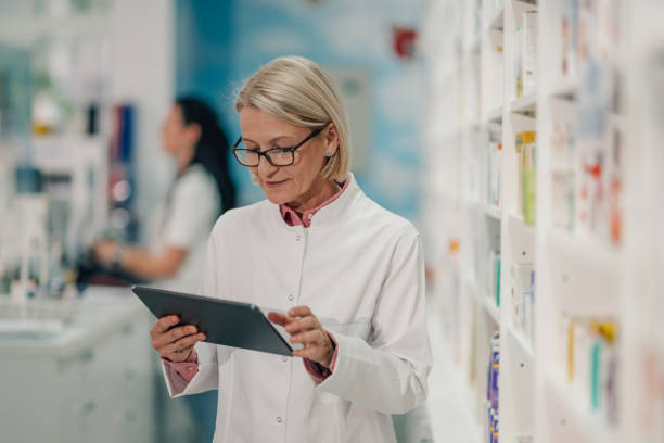 istock Senior female pharmacist using digital tablet in pharmacy 2178779118