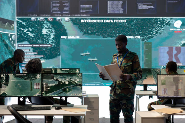 istock Special operations engineer reading new mission case file brief in control room 2178780433
