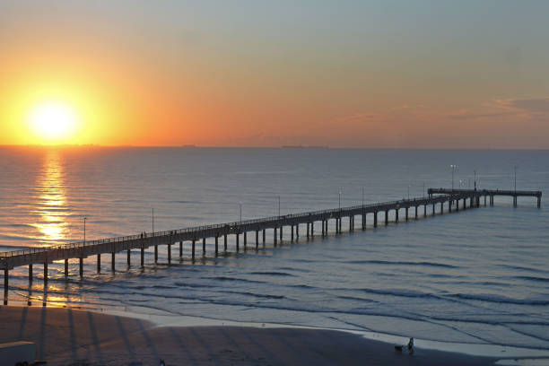 The Horace Caldwell Pier at IB Magee Beach Park is a 1,240-foot structure and one of the most popular spots for fishing and walking in Port Aransas, Texas, especially at sunrise and sunset.