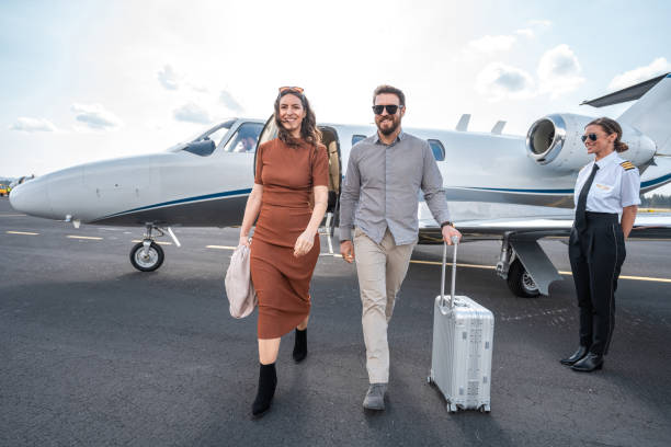 istock Affluent Couple Exiting Private Aircraft 2178788491
