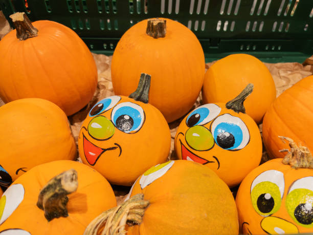 istock Cheerful Halloween Pumpkins with Cartoon Faces 2178790424