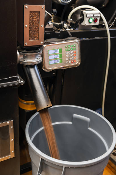 istock Roasted coffee beans just after roasting are poured from roaster 2178794686