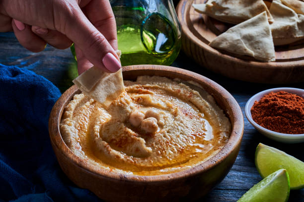istock Chickpea hummus in a bowl garnished with paprika and olive oil. 2178797775