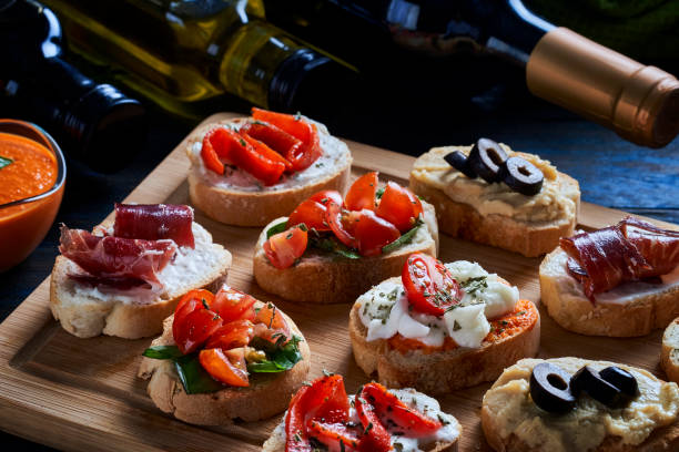 Appetizers and tapas themes: High angle view of an assortment of Mediterranean appetizers or tapas on a cutting board