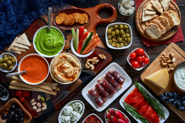 istock Table top view of antipasto assortment on rustic wooden board. 2178797805