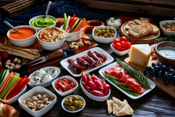 istock High angle view of antipasto assortment on rustic wooden board. 2178797829