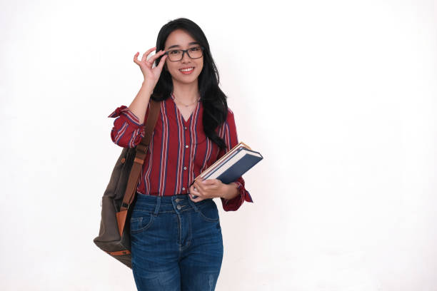istock Asian scholarship student standing and bringing some books and school bag in her hands 2178797979