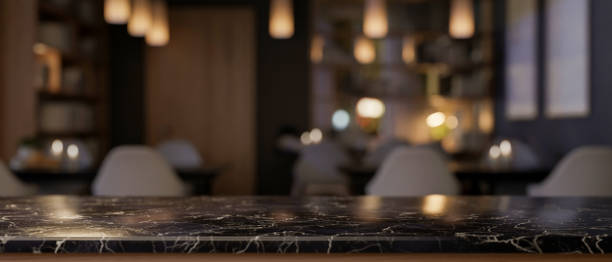 istock A luxury black marble tabletop with a blurred background of an elegance restaurant at night. 2178800981