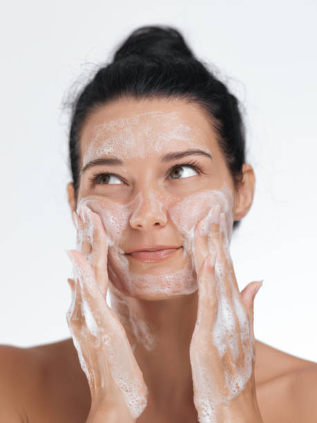 istock Woman Making Playful Expression While Washing Face with Foam, Skincare Concept 2178802774