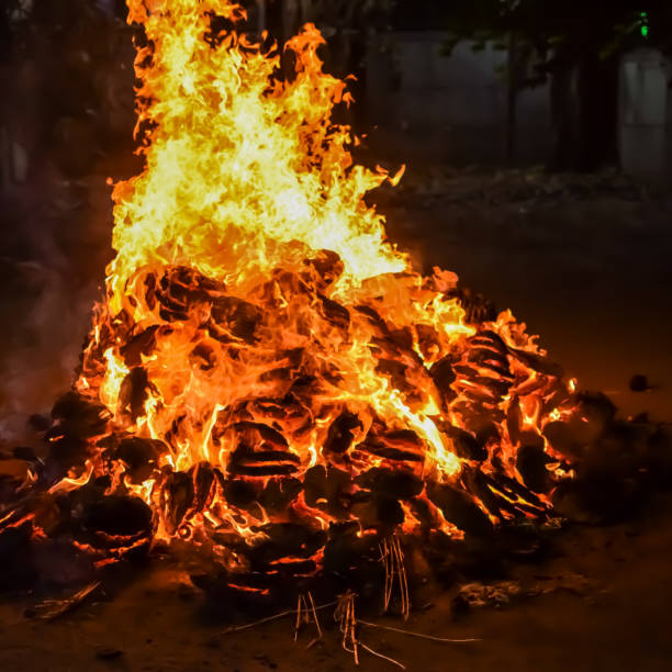 istock Fire flames on black background, Blaze fire flame texture background, Beautifully, the fire is burning, Fire flames with wood and cow dung bonfire 2178802794