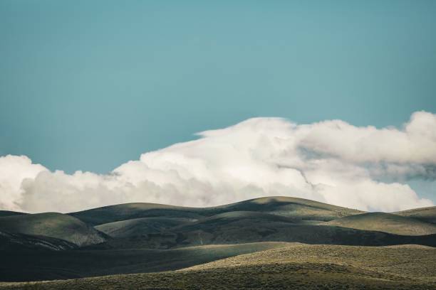 istock Serene landscape of rolling hills and blue sky 2178810026
